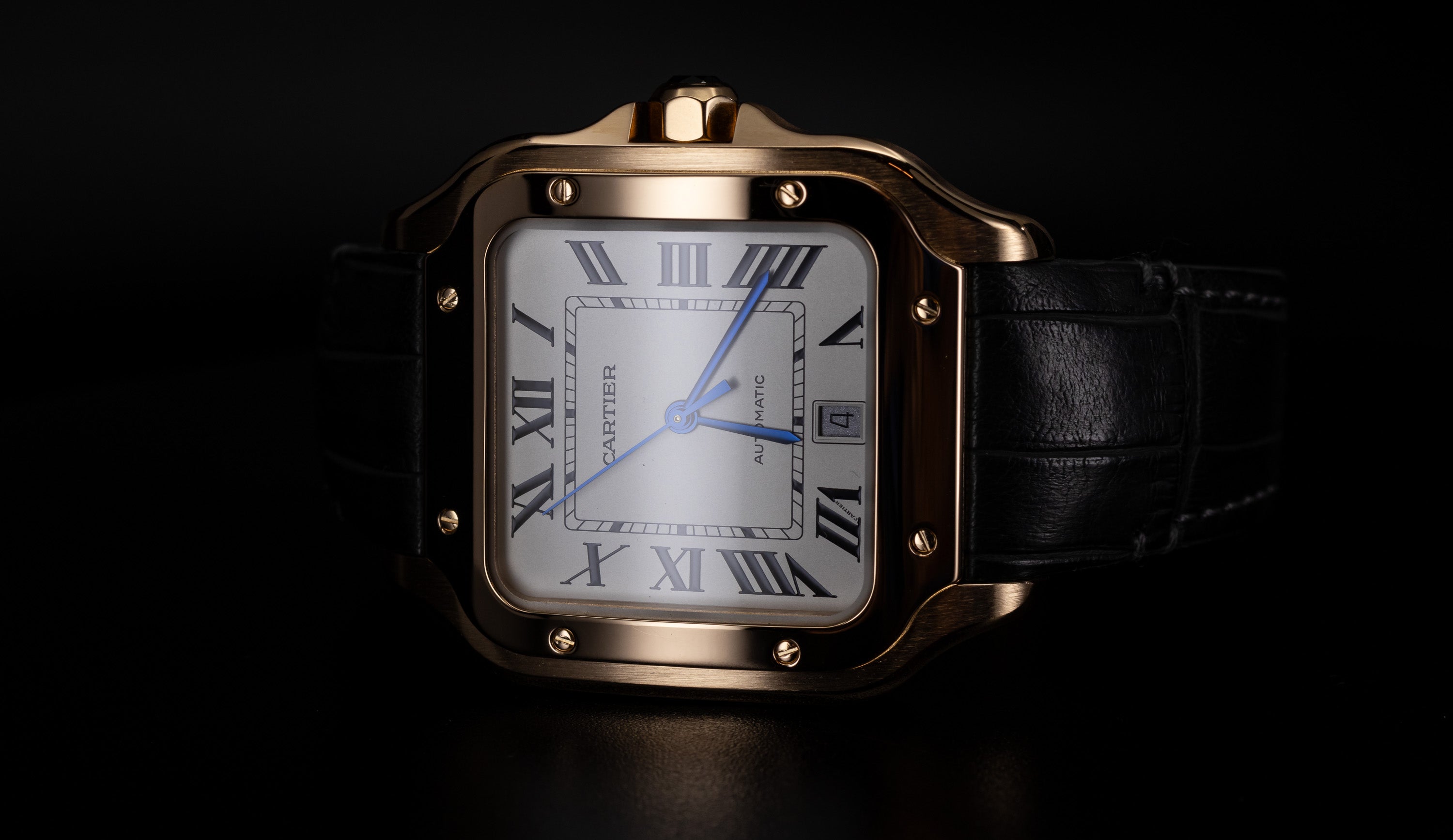 Cartier Santos de Cartier 18K Rose Gold with fixed screw down bezel blue sword hands silver opaline dial and date aperture WGSA0011