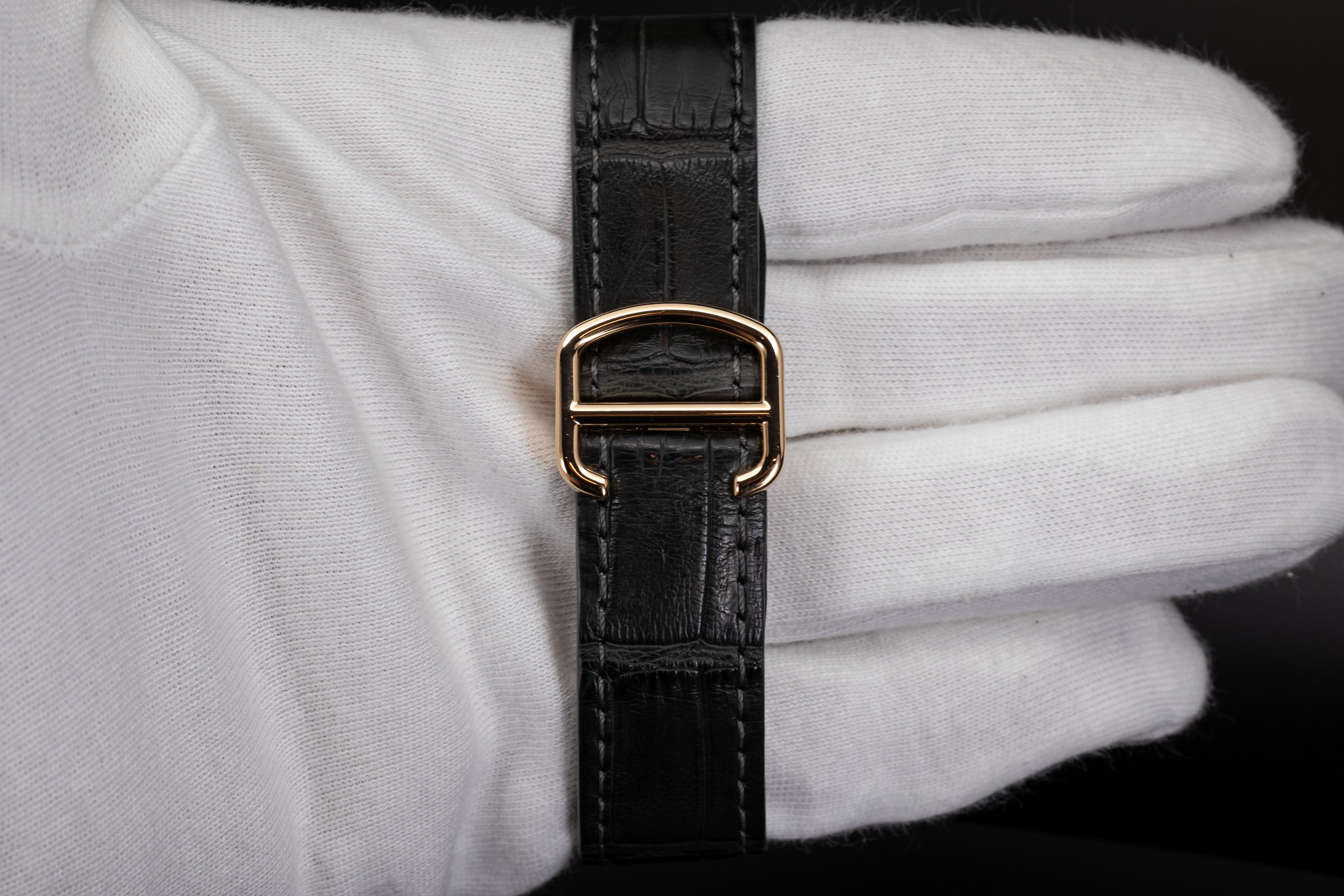 Cartier Santos de Cartier strap in gloved hand