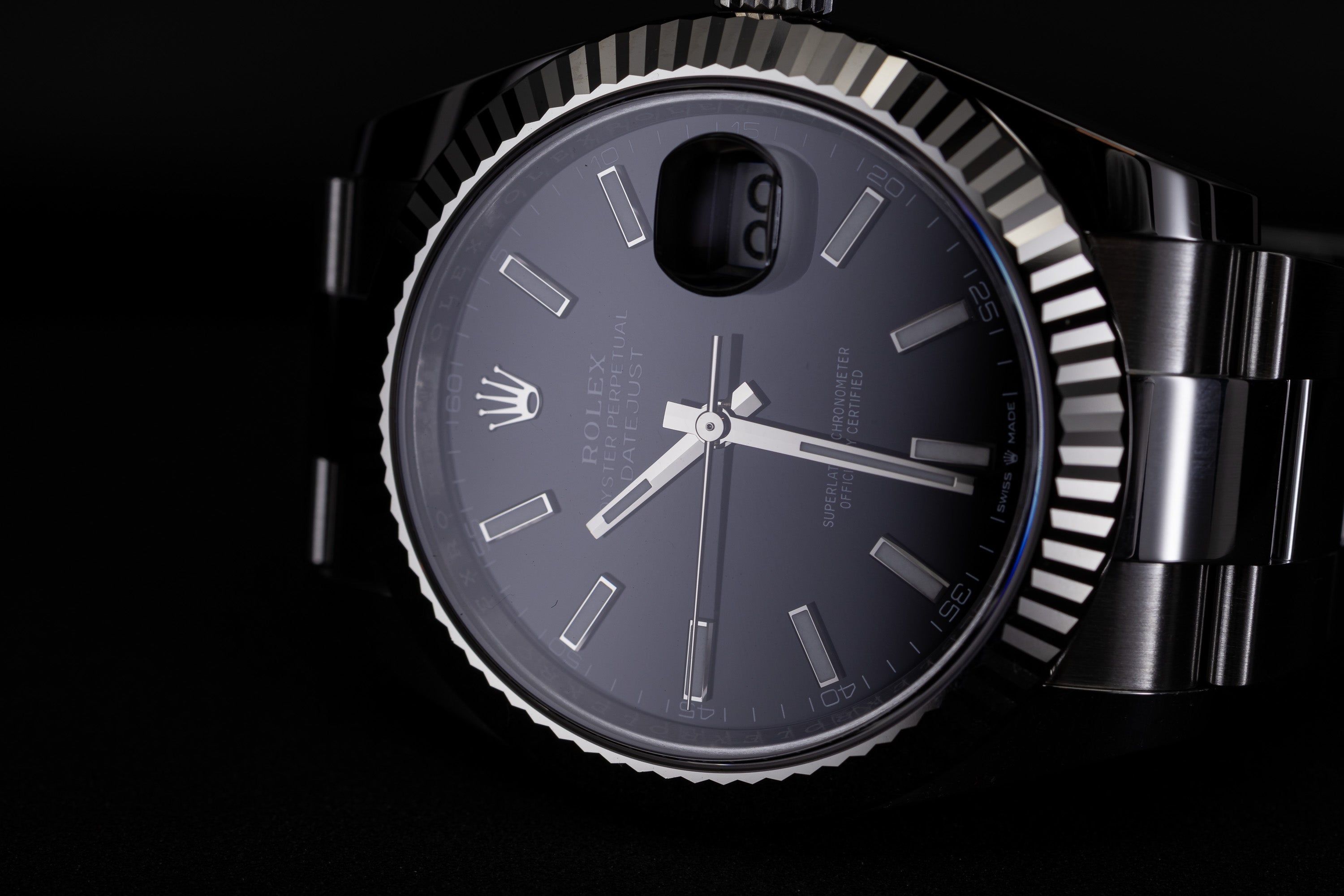 Rolex Datejust 41 126334 with blue tint from the sapphire's anti reflective coating.