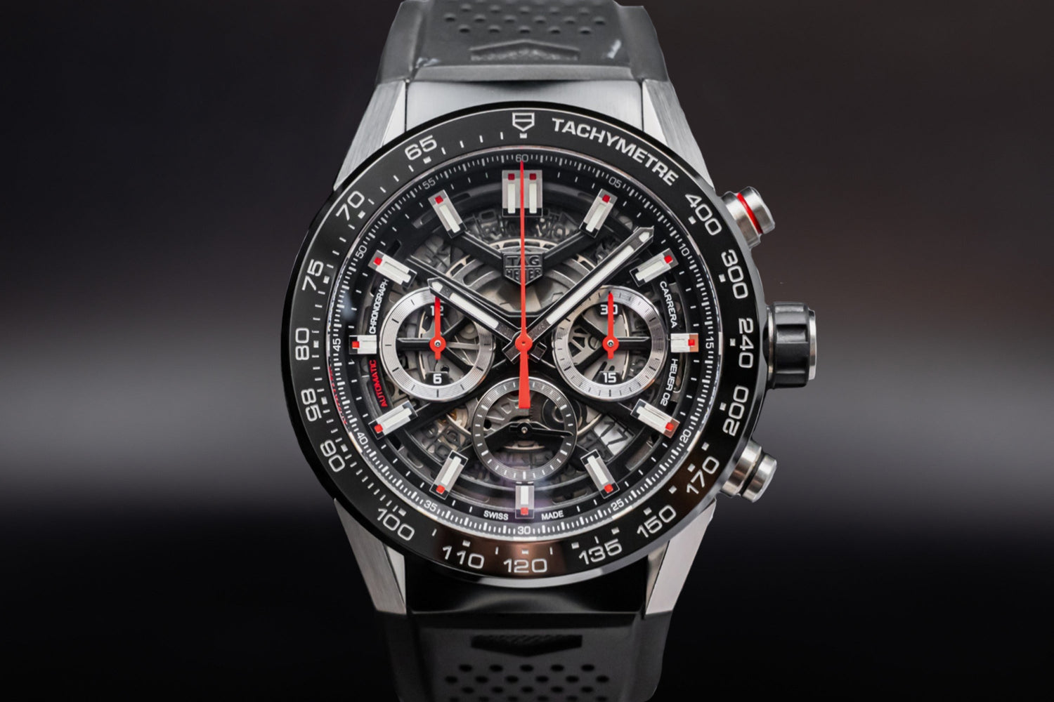TAG Heuer Carrera luxury sports watch with skeleton dial and rubber strap