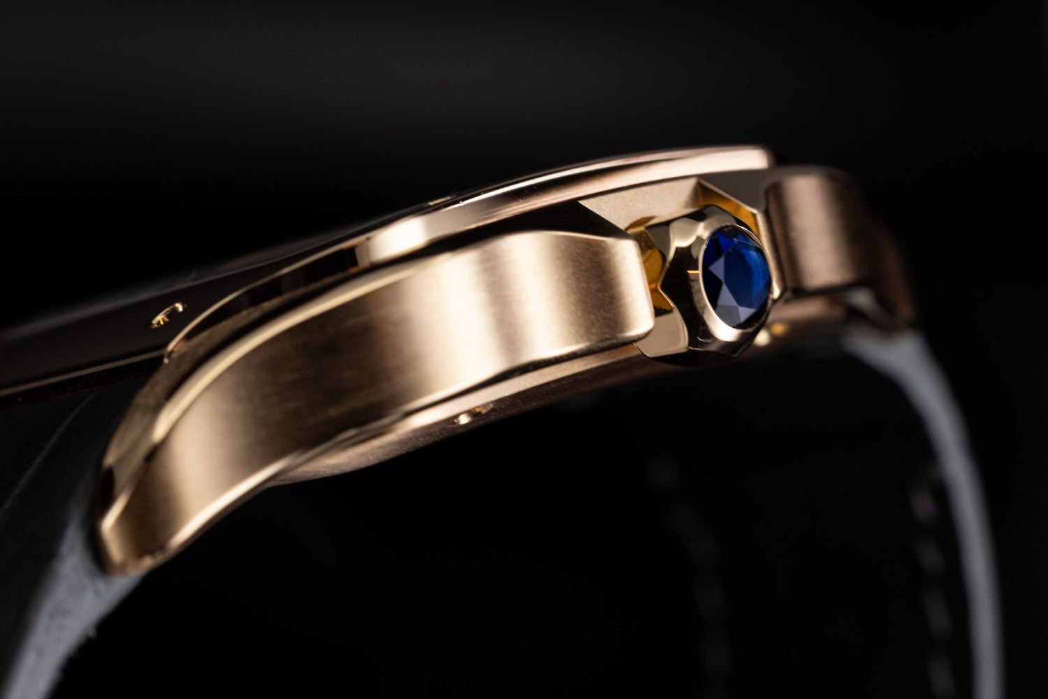 Rose gold Cartier Santos featuring the blue sapphire crown and brushed crown guards