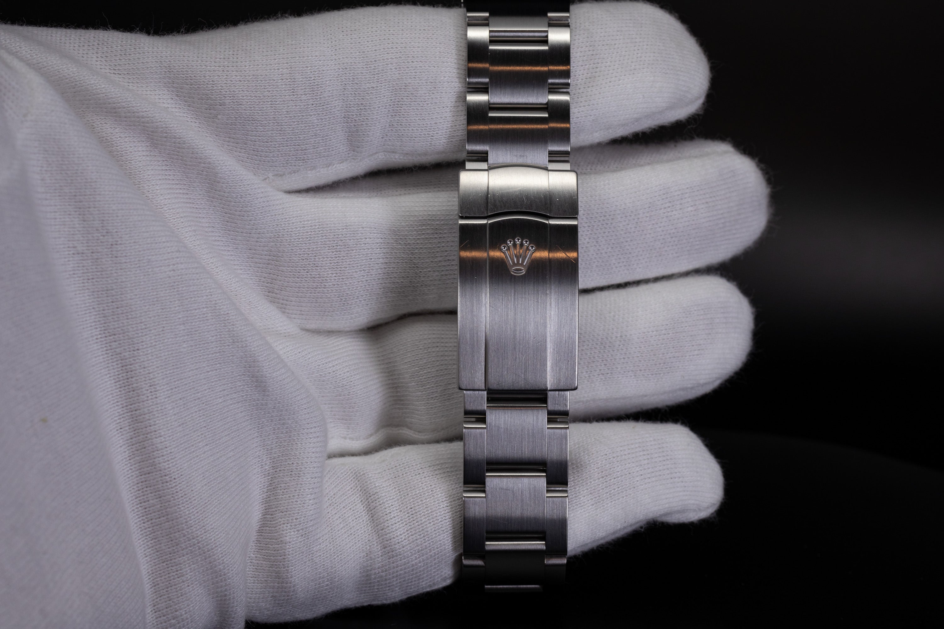 Rolex Air-King Oyster clasp and oyster bracelet in white gloved hand