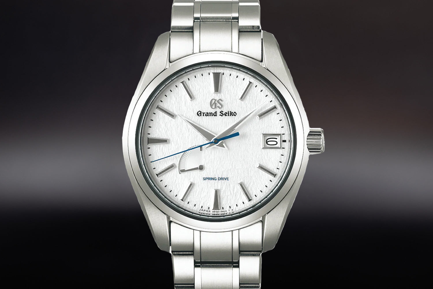 Grand Seiko Snowflake luxury sports watch with white dial and stainless steel bracelet