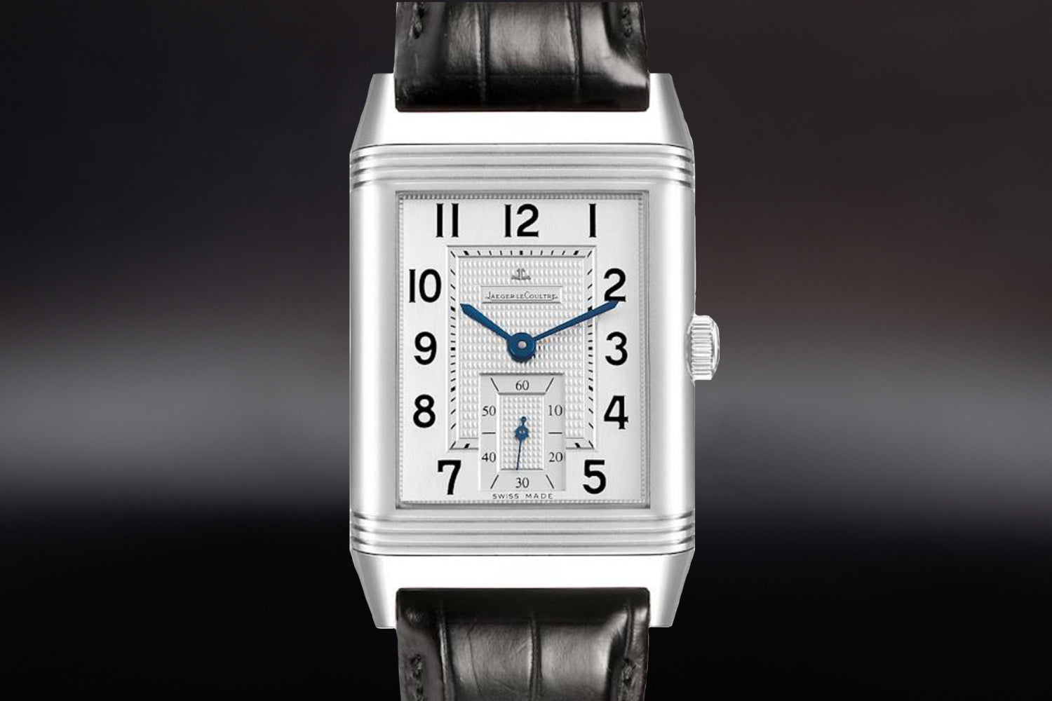 Jaeger-LeCoultre Reverso luxury watch with silver dial and leather bracelet