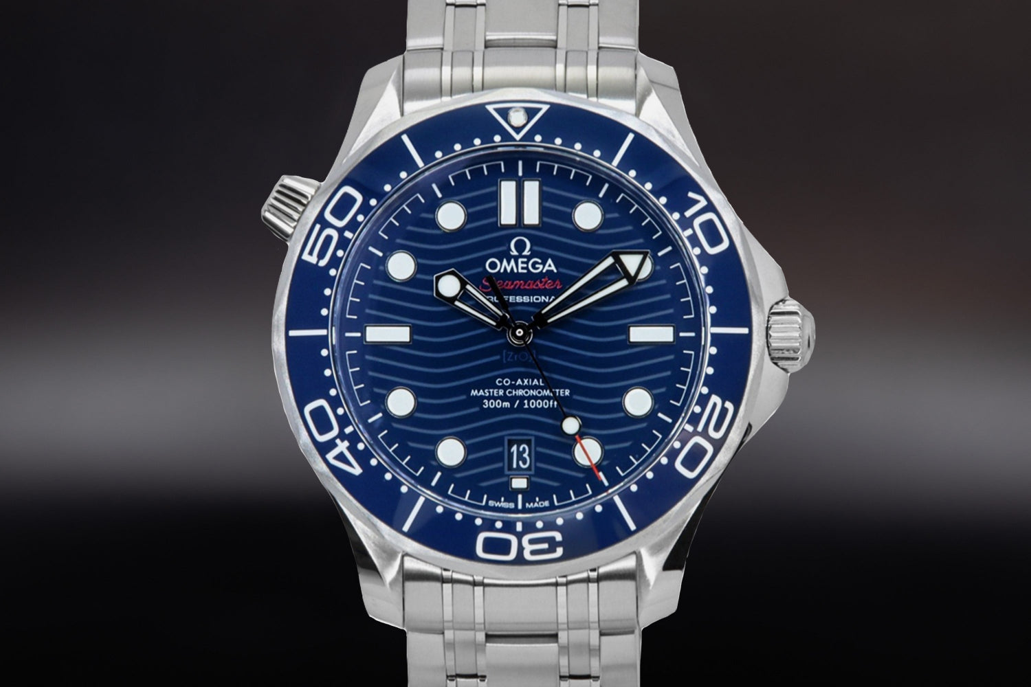 Omega Seamaster Diver 300M luxury sports watch with blue dial and stainless steel bracelet