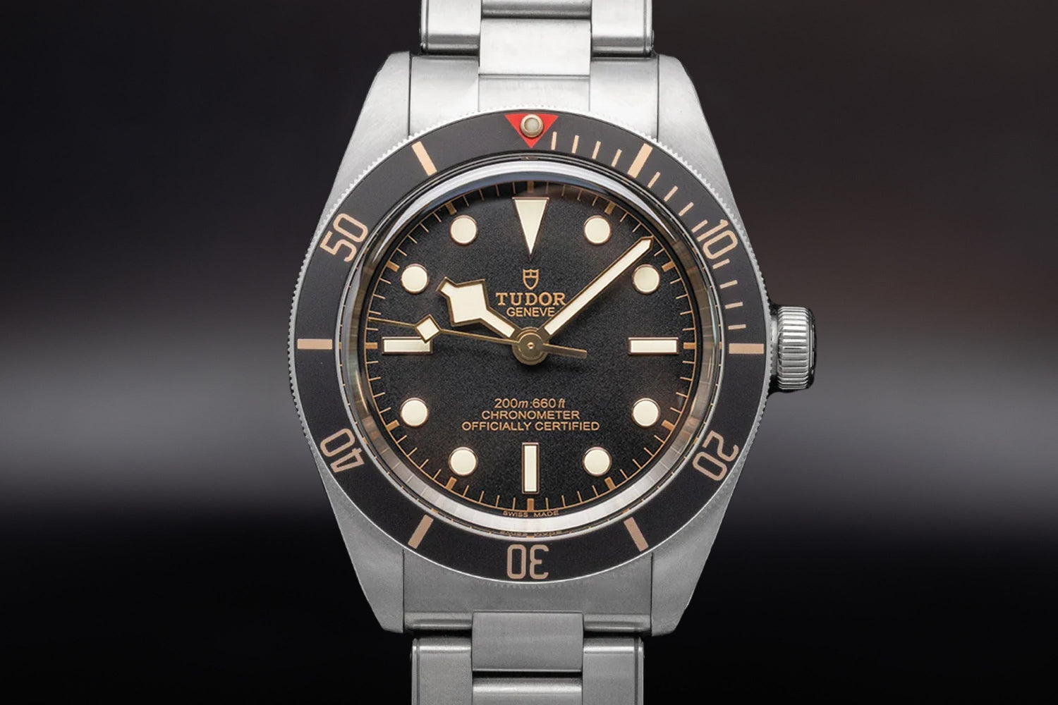 Tudor Black Bay luxury sports watch with black dial and stainless steel bracelet